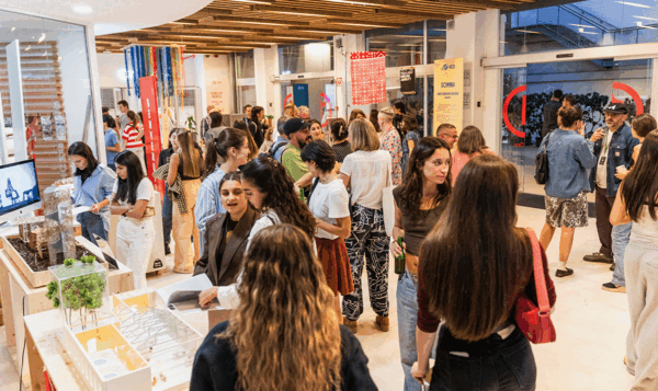 A group of people at the opening of a design exhibition